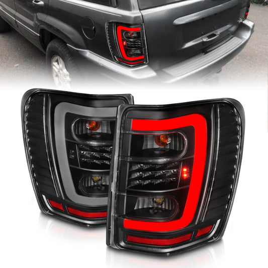 ANZO 1999-2004 Jeep Grand Cherokee LED Tail Lights w/ Light Bar Black Housing Clear Lens